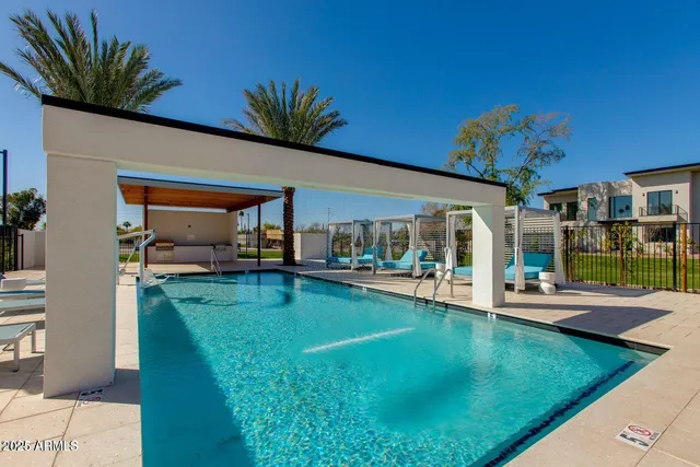 a view of a house with a backyard porch and sitting area