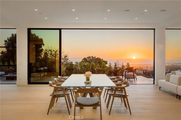 a large kitchen with kitchen island a sink table and chairs