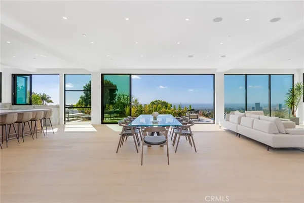 a living room with furniture and flat screen tv