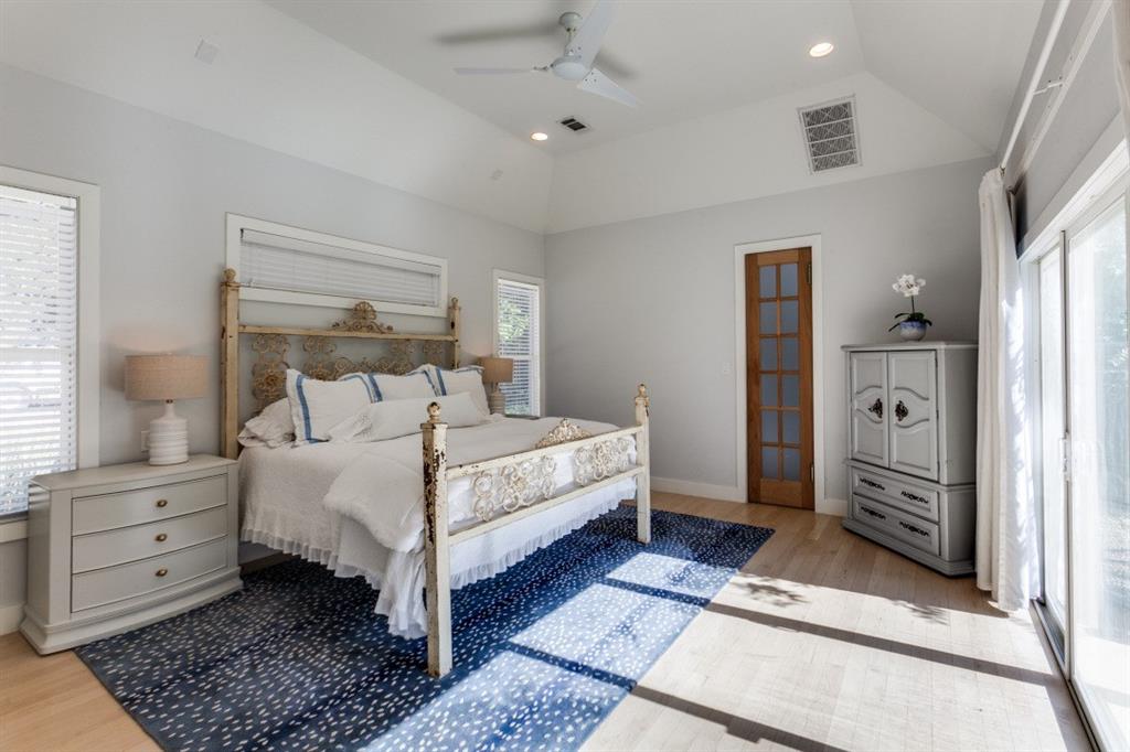 4206 Manning Lane Dallas, TX 75220 - Photo 19 of 35 a bedroom with a bed and a dresser