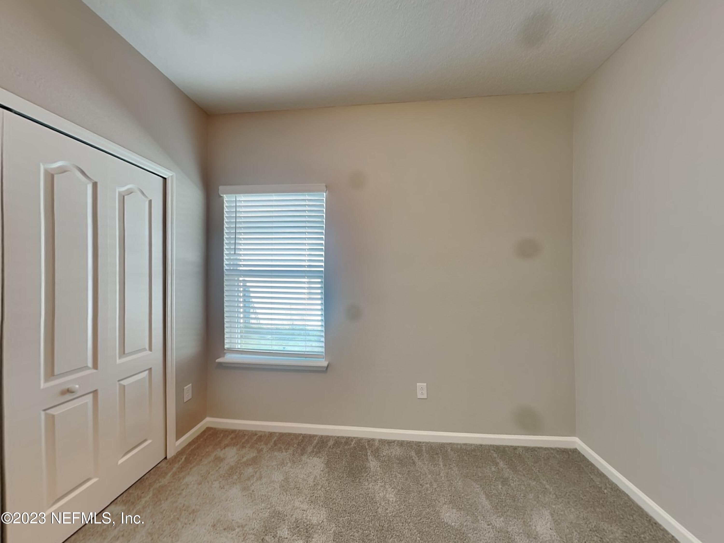 164 Bloomfield Way St. Augustine, FL 32092 - Photo 11 of 21 an empty room with windows