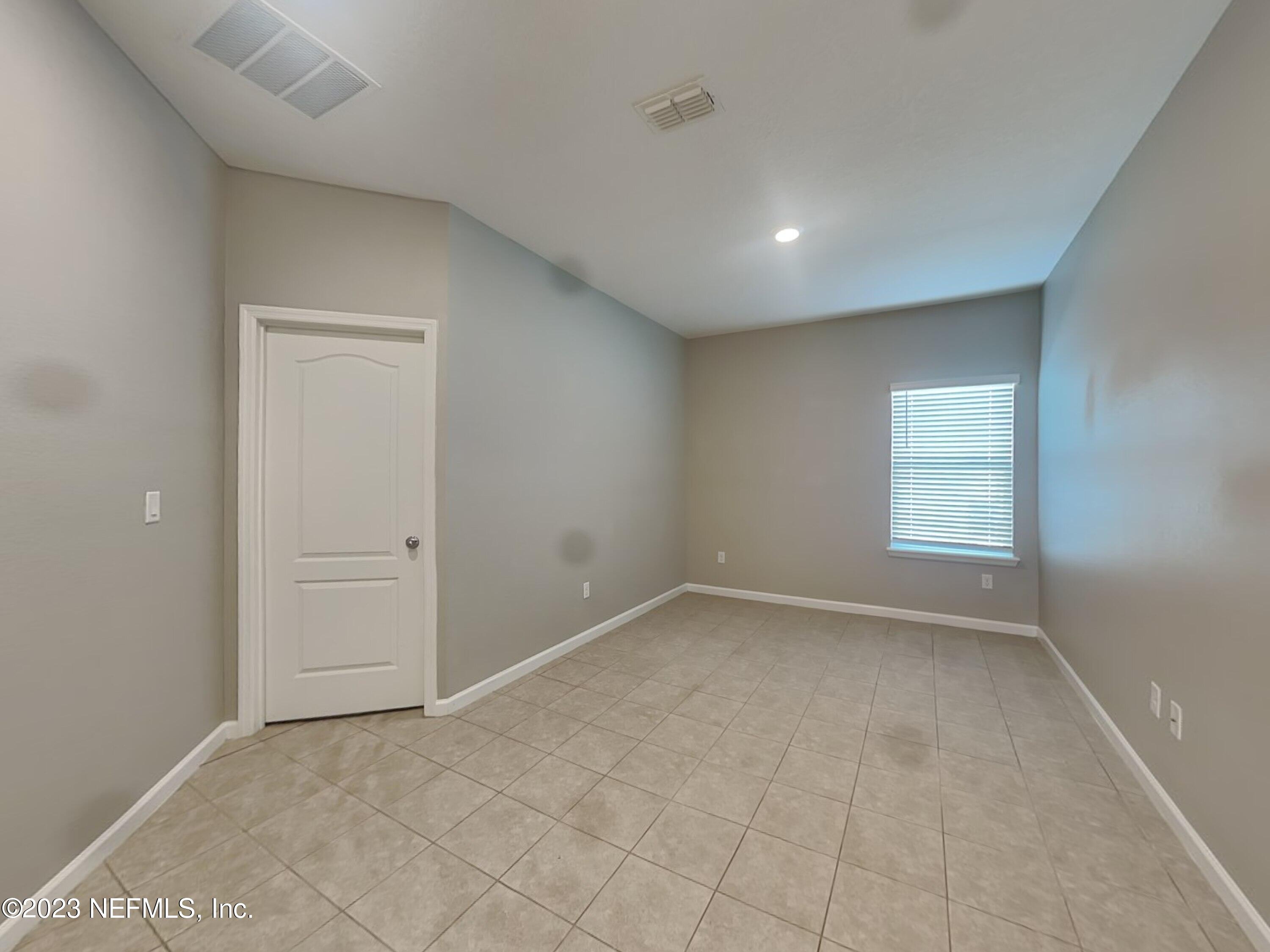 164 Bloomfield Way St. Augustine, FL 32092 - Photo 17 of 21 a view of an empty room with a window
