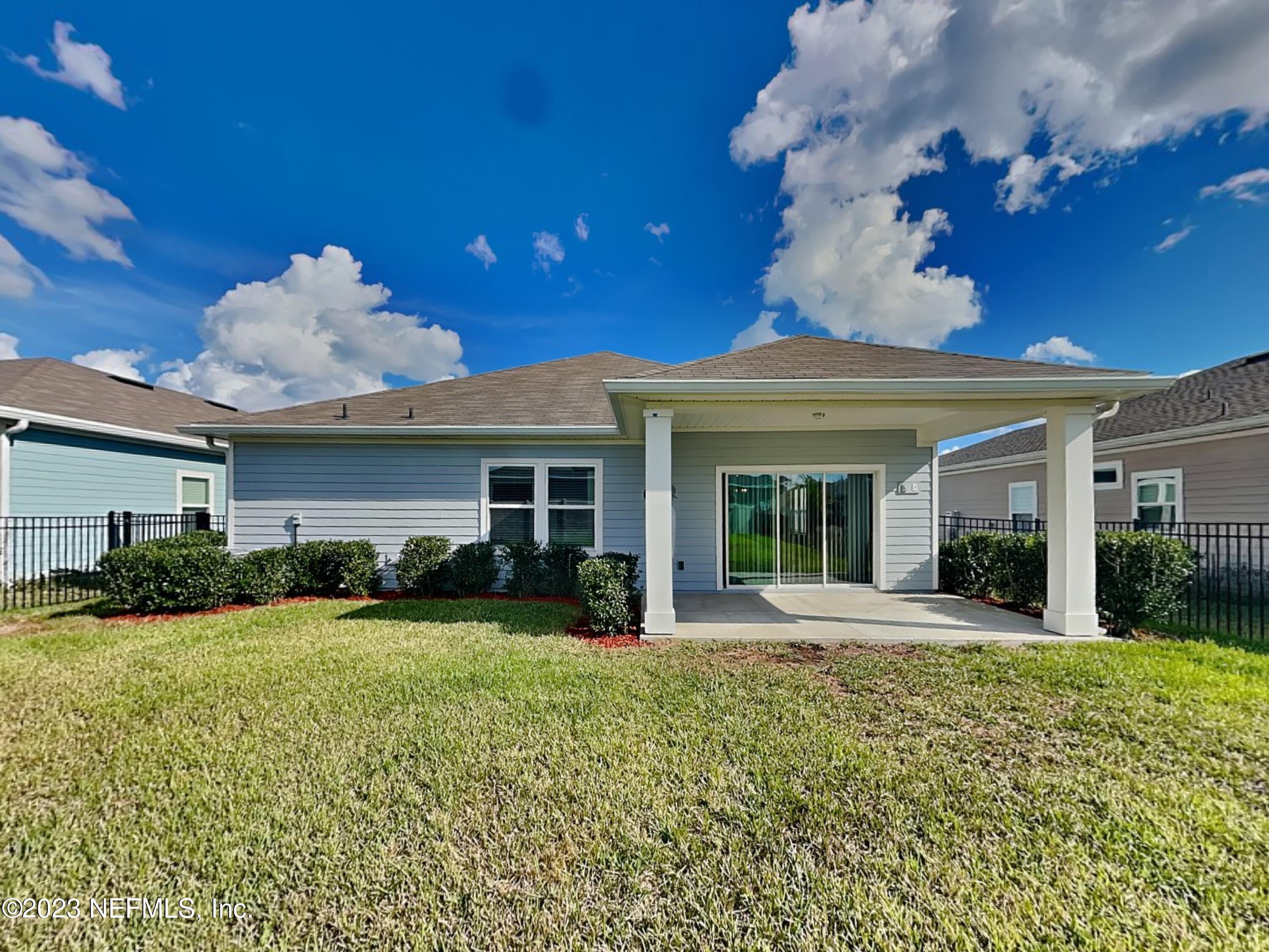 164 Bloomfield Way St. Augustine, FL 32092 - Photo 20 of 21 a view of a house with a big yard and potted plants