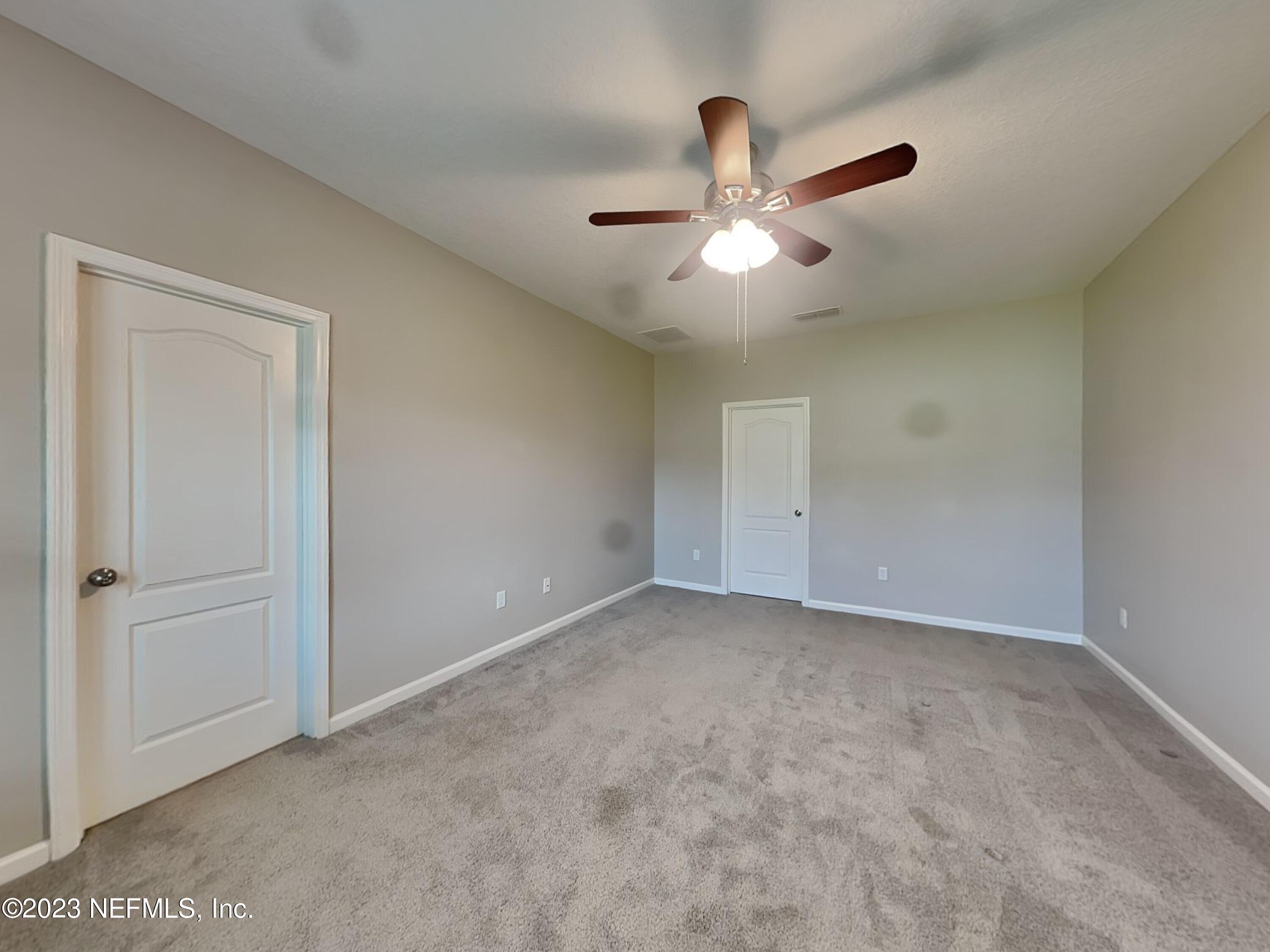 164 Bloomfield Way St. Augustine, FL 32092 - Photo 7 of 21 an empty room with closet and windows