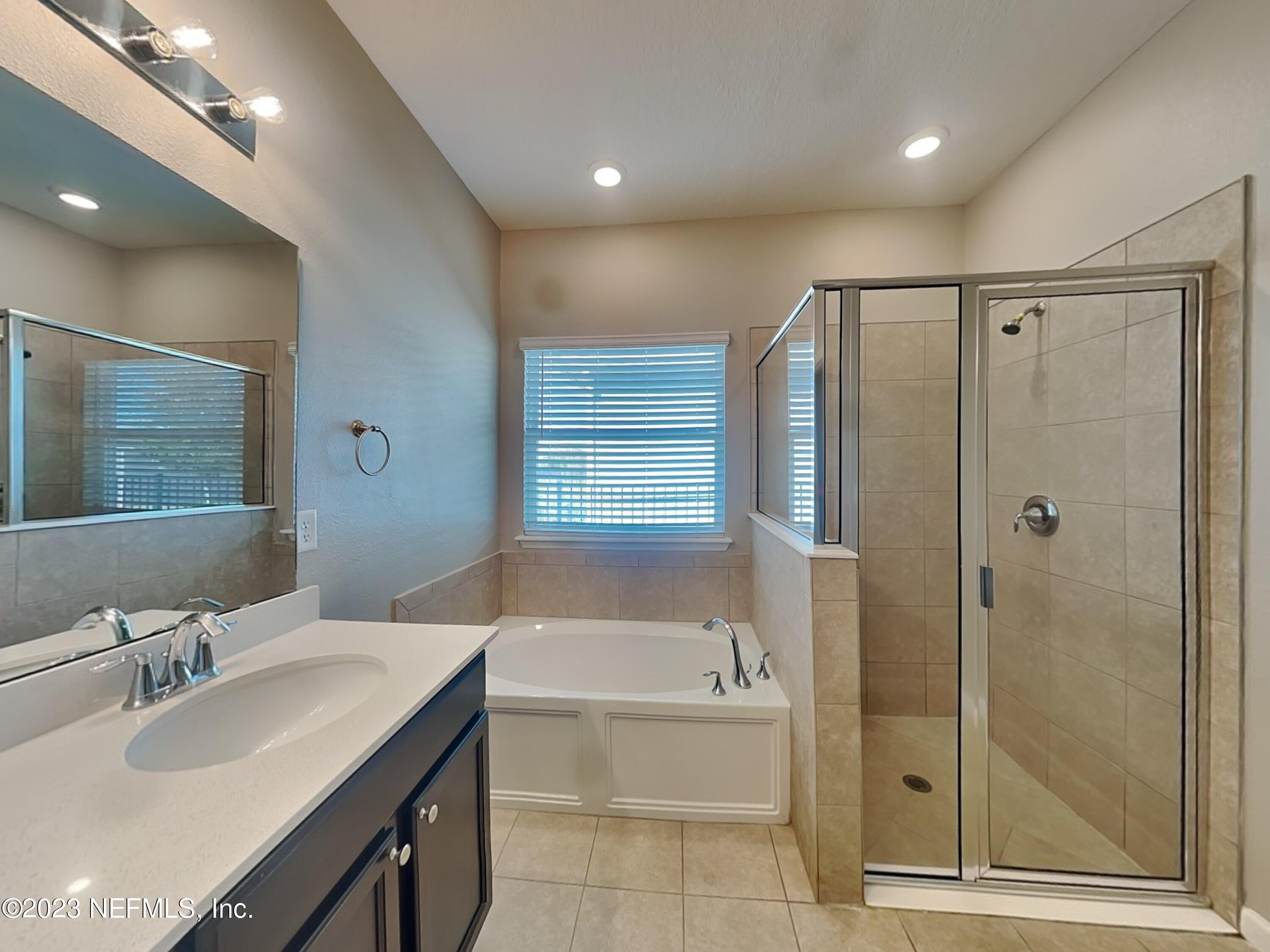 164 Bloomfield Way St. Augustine, FL 32092 - Photo 10 of 21 a bathroom with a bathtub and a sink
