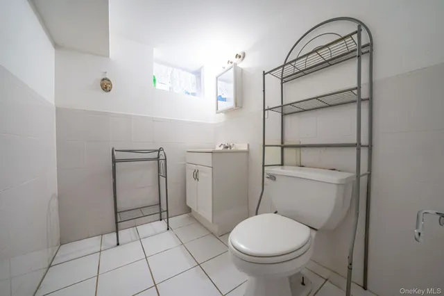 a bathroom with a toilet and a sink