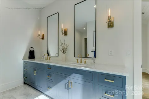 a bathroom with a double vanity sink and mirror
