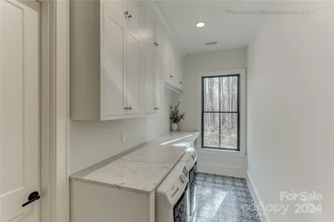 a kitchen with a sink a stove and cabinets