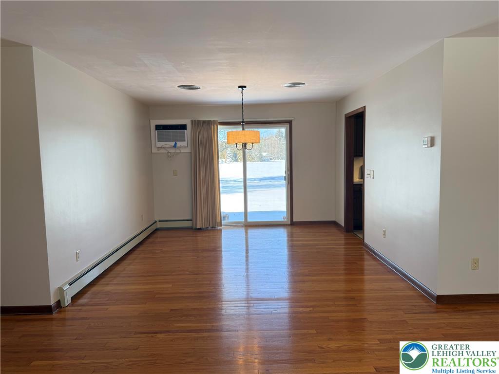 4754 Lowhill Church Road New Tripoli, PA 18066 - Photo 13 of 17 a view of an empty room with window and wooden floor