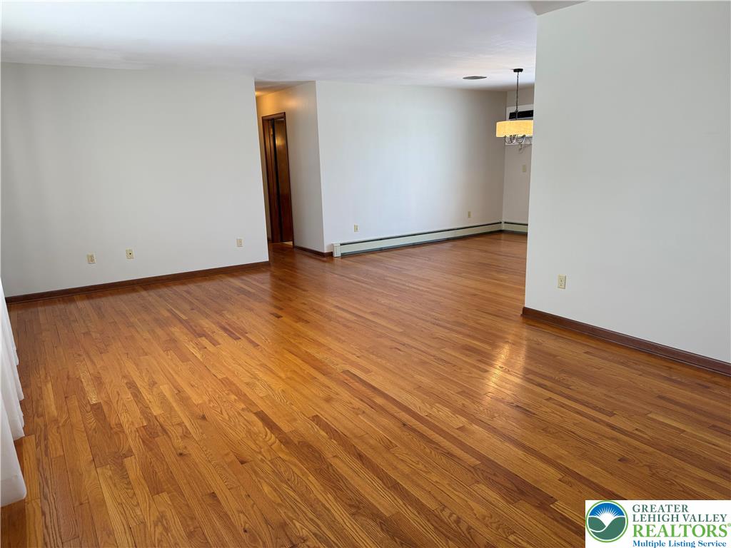 4754 Lowhill Church Road New Tripoli, PA 18066 - Photo 14 of 17 an empty room with wooden floor and entrance