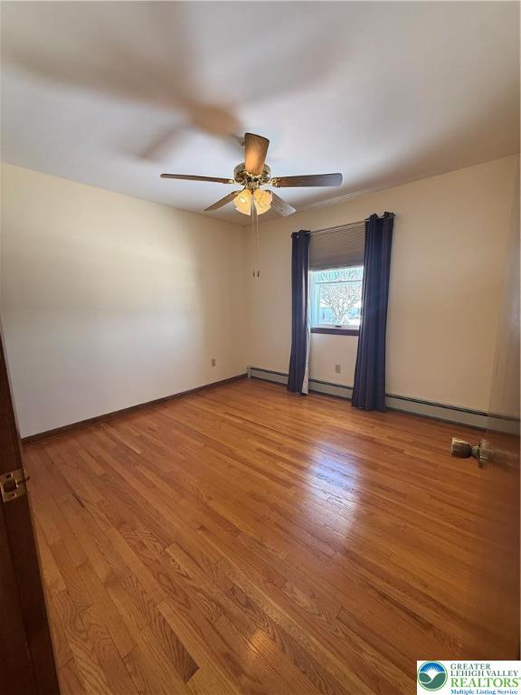 4754 Lowhill Church Road New Tripoli, PA 18066 - Photo 9 of 17 an empty room with wooden floor chandelier fan and windows