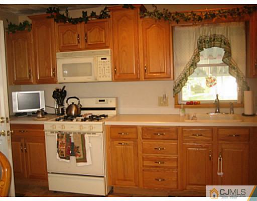 26 Dover Road Colonia, NJ 07067 - Photo 4 of 13 a kitchen with a cabinets and window