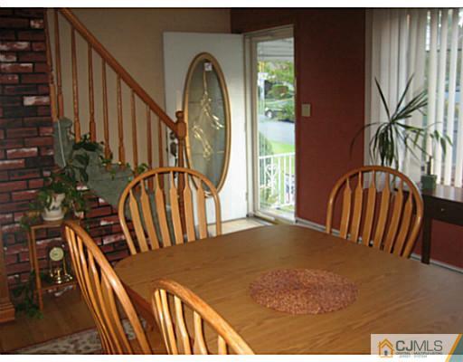 26 Dover Road Colonia, NJ 07067 - Photo 5 of 13 a view of stairs and dining room