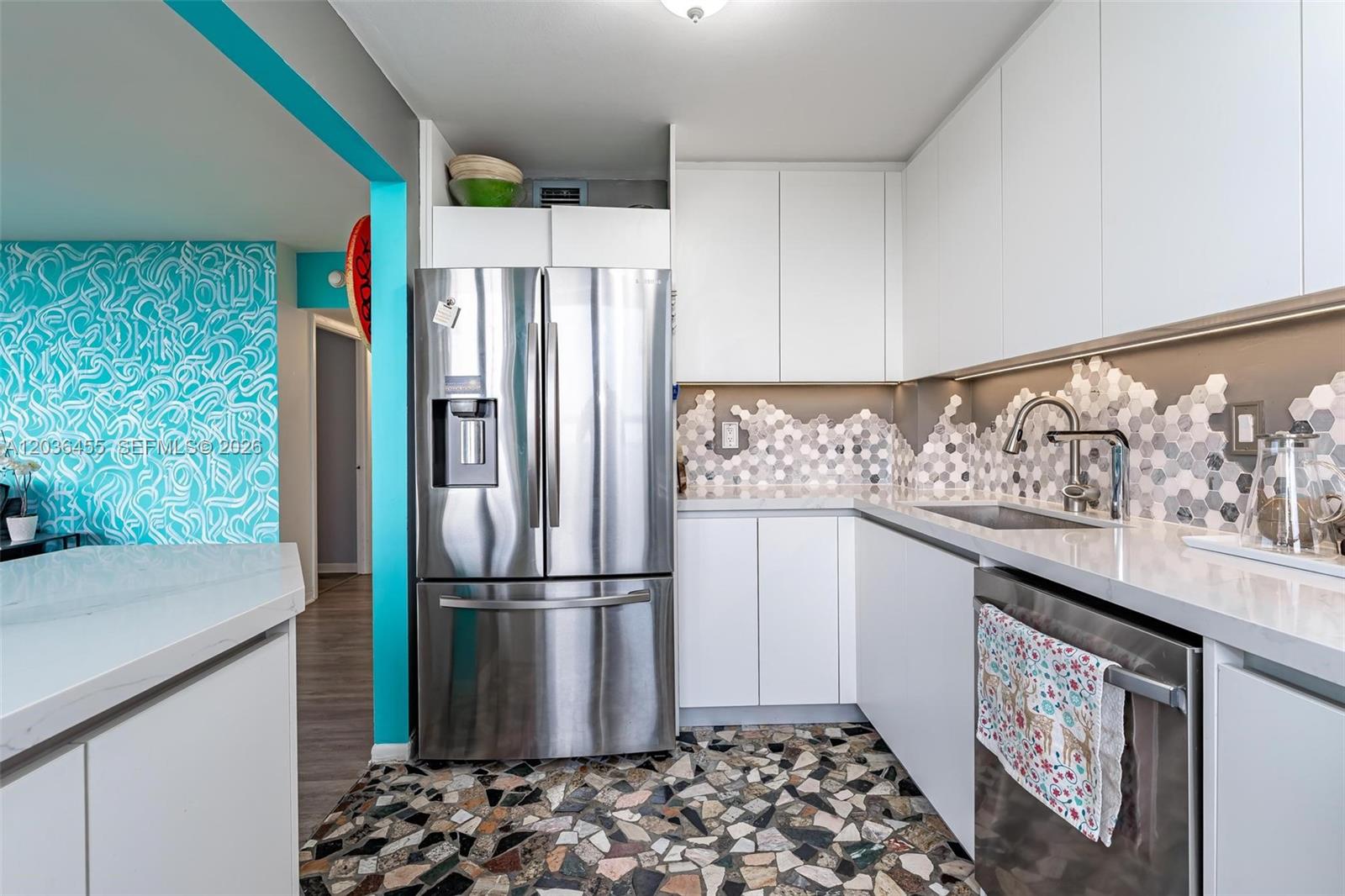 780 Northeast 69th Street, Unit 1010 Miami, FL 33138 - Photo 11 of 31 a kitchen with stainless steel appliances granite countertop a refrigerator and a sink