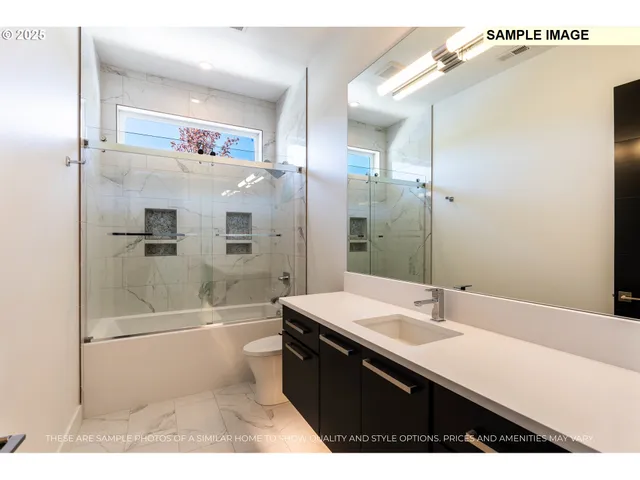 a bathroom with a double vanity sink mirror and shower