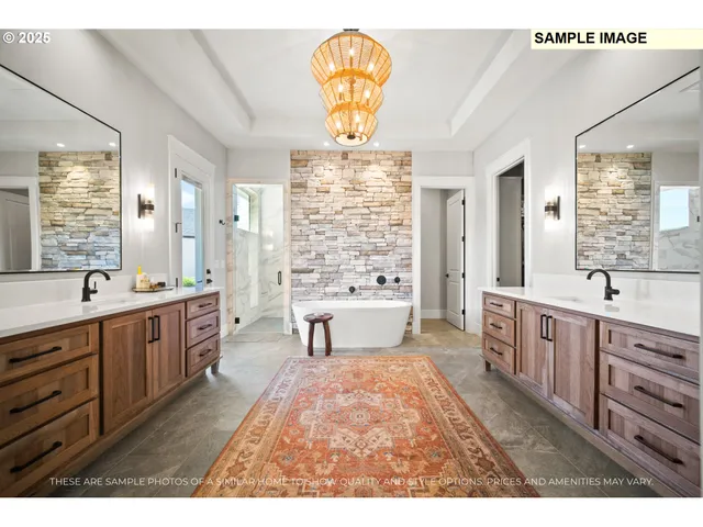 a spacious bathroom with a double vanity sink a large mirror and a bathtub