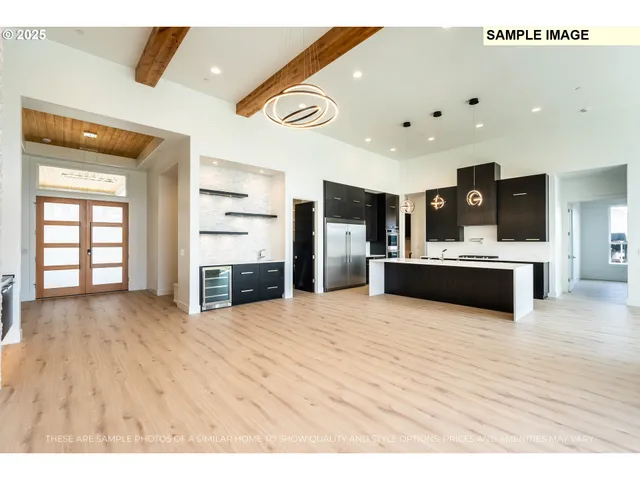 a view of kitchen with kitchen island granite countertop a sink and counter space