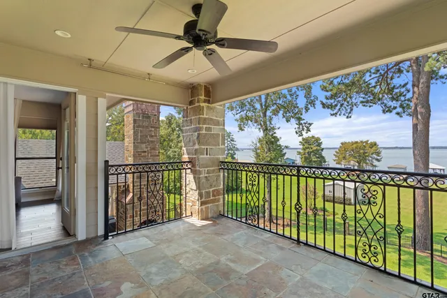 a view of a balcony with furniture