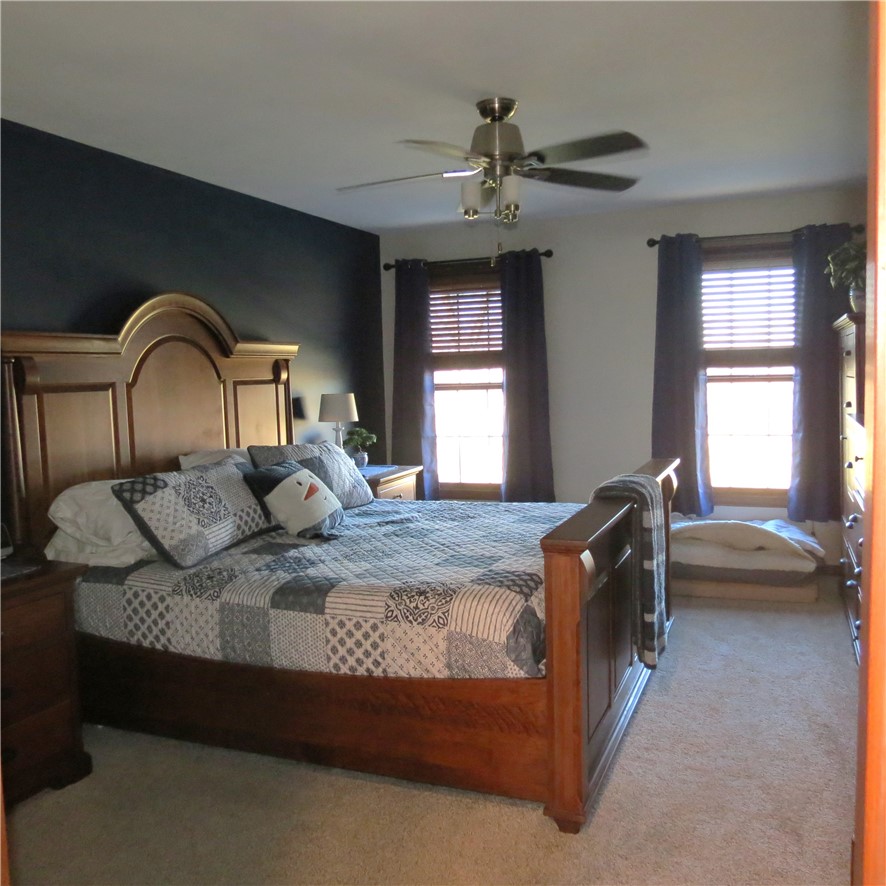 10160 Lochard Road Sidney, OH 45365 - Photo 19 of 41 This restful bedroom offers a spacious layout and abundant natural light.