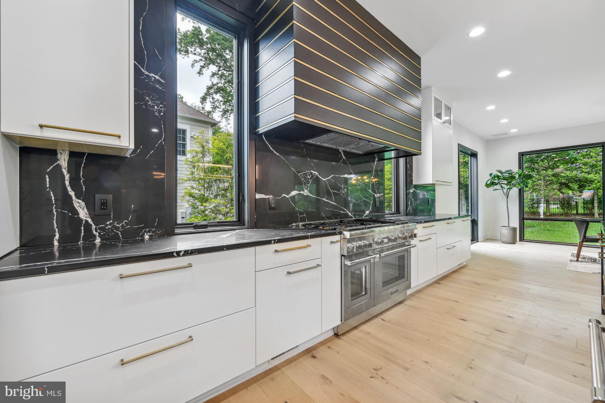 7102 Capitol View Drive McLean, VA 22101 - Photo 15 of 40 a large kitchen with stainless steel appliances granite countertop a sink and cabinets