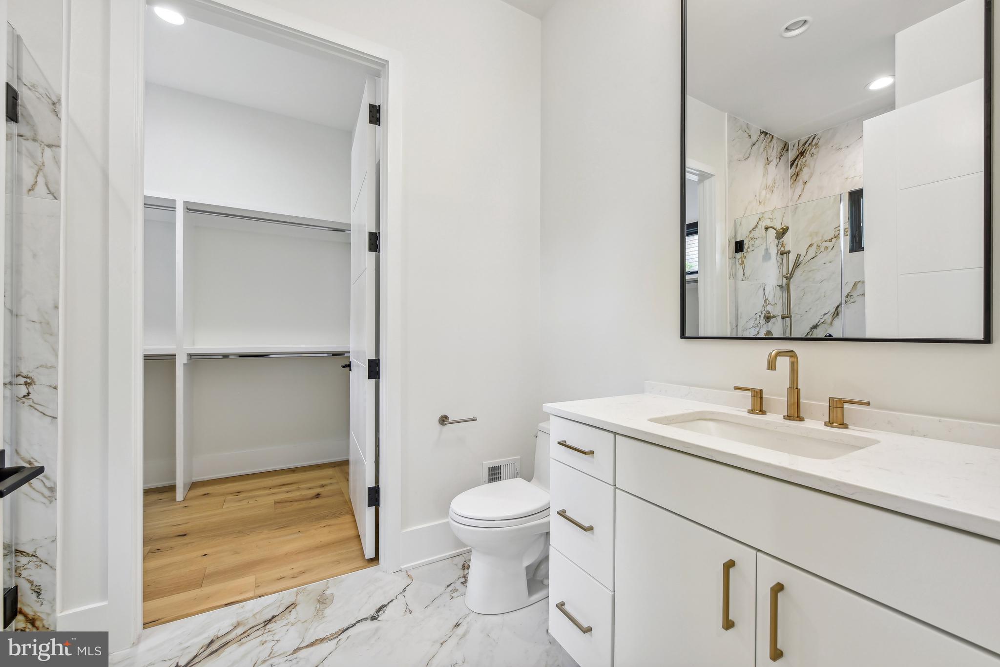7102 Capitol View Drive McLean, VA 22101 - Photo 20 of 40 a bathroom with a sink a toilet and shower