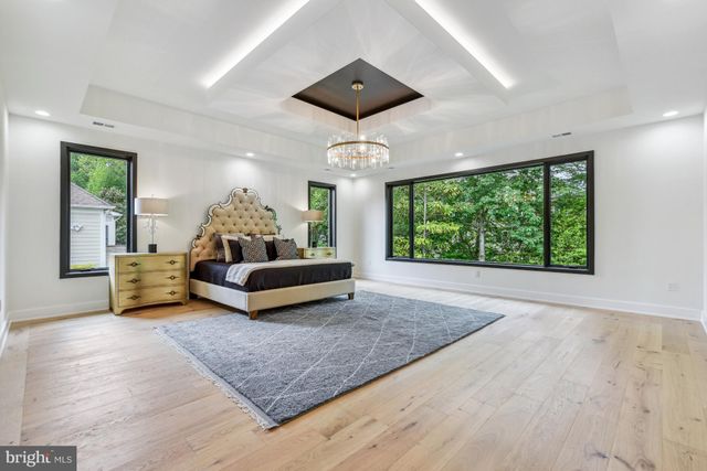 a bathroom with a sink a mirror and a window