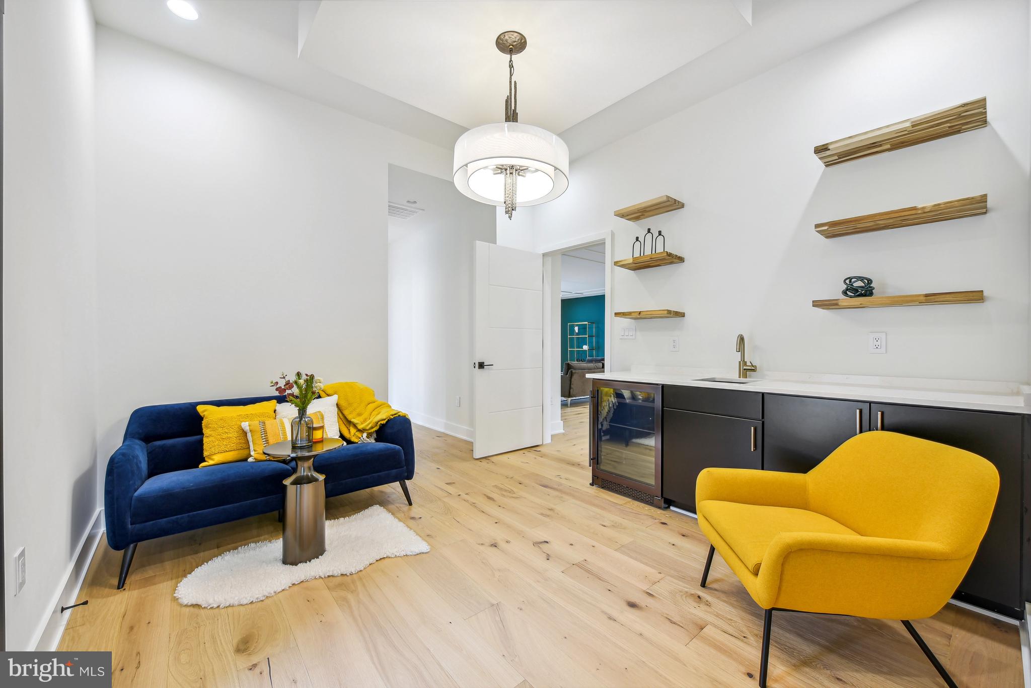 7102 Capitol View Drive McLean, VA 22101 - Photo 24 of 40 a living room with furniture and a chandelier