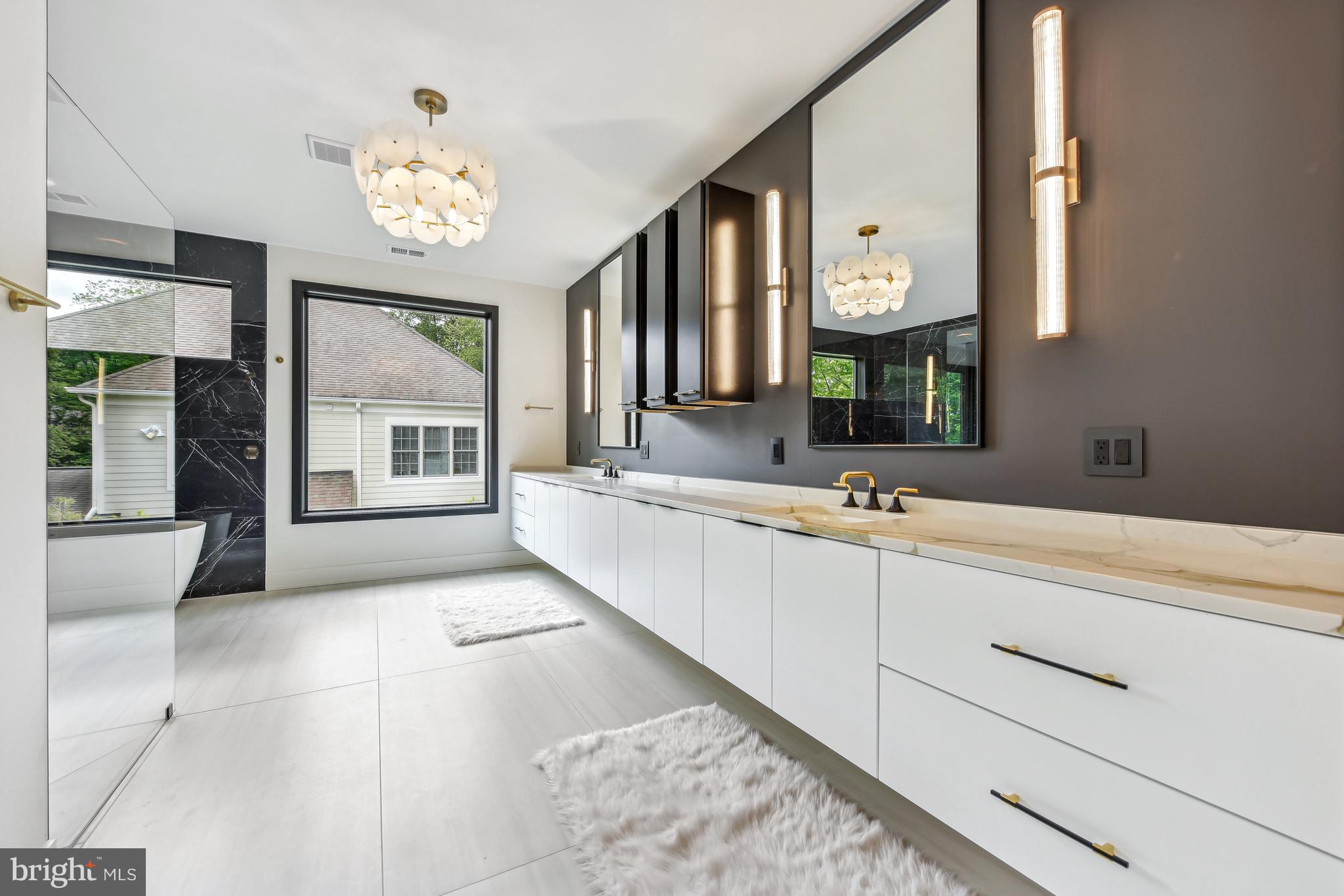 7102 Capitol View Drive McLean, VA 22101 - Photo 26 of 40 a bathroom with a sink a mirror and a window