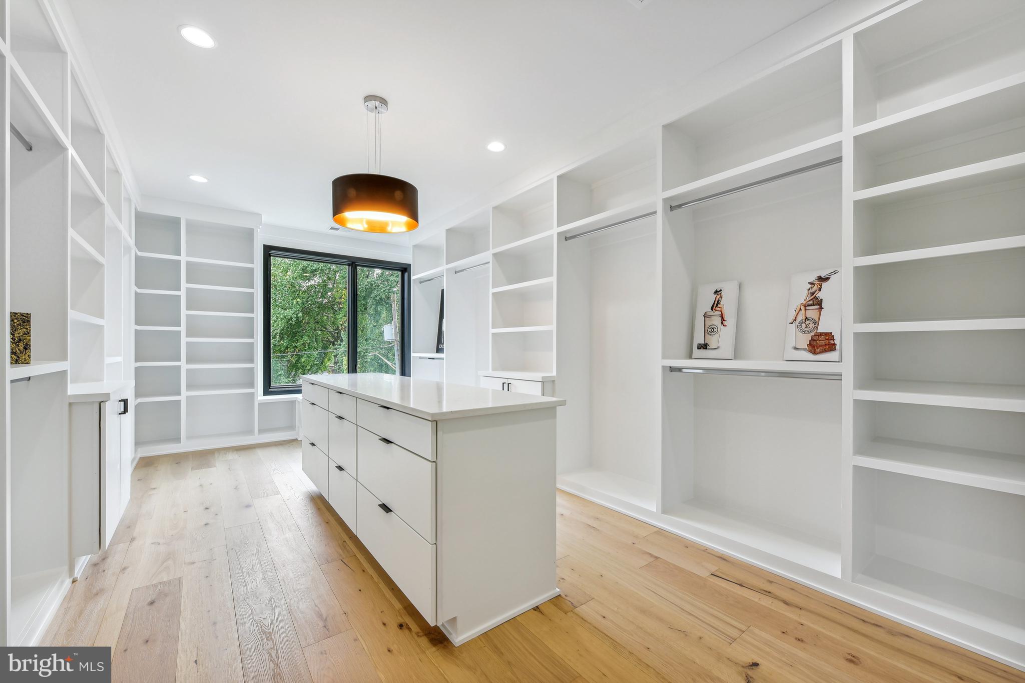 7102 Capitol View Drive McLean, VA 22101 - Photo 28 of 40 a room with cabinets and a wooden floor