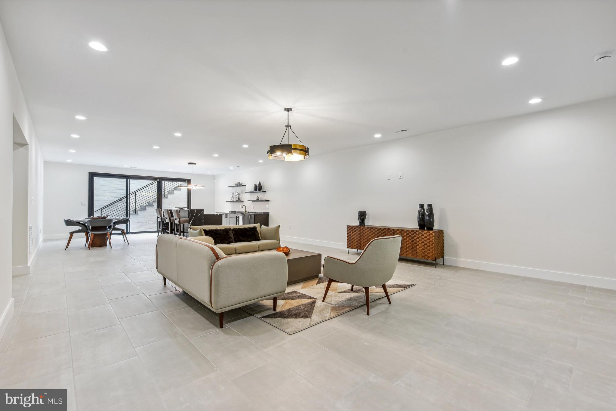 7102 Capitol View Drive McLean, VA 22101 - Photo 30 of 40 a living room with furniture and a chandelier