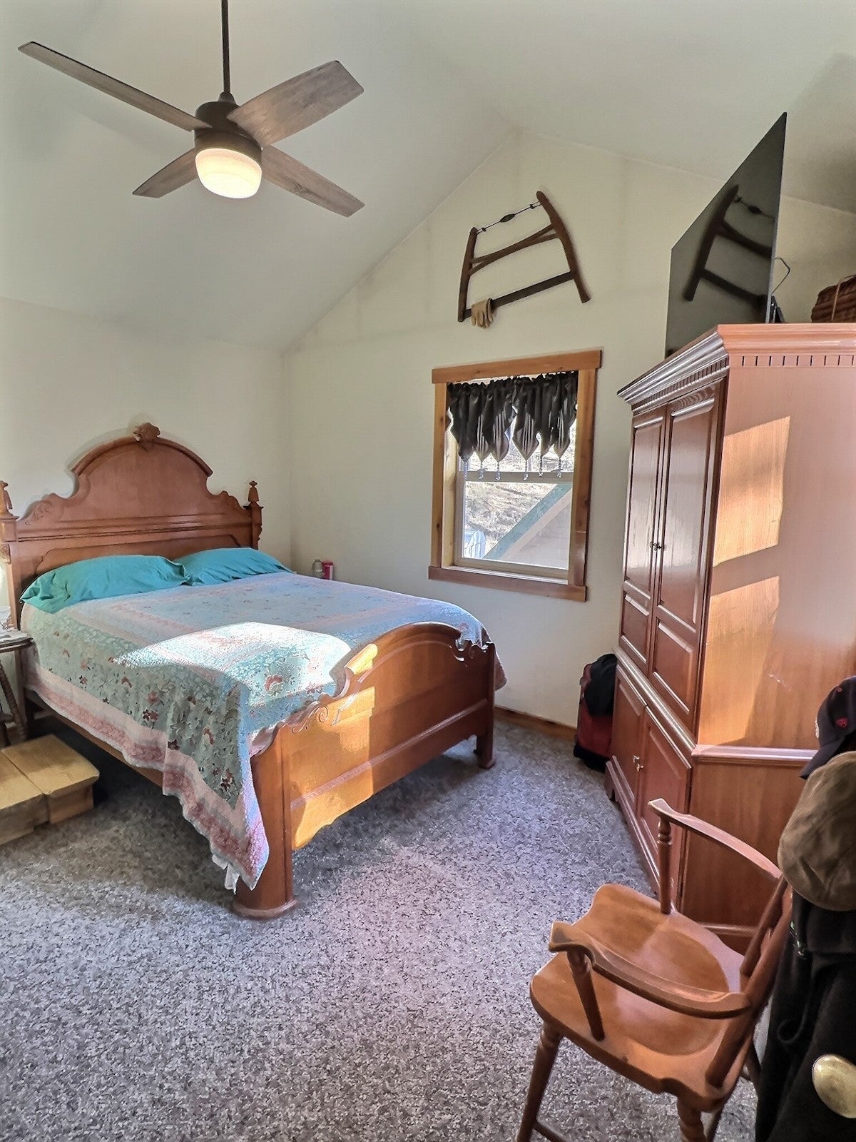 152 Buffalo Bill Road Plains, MT 59859 - Photo 34 of 71 Bedroom featuring lofted ceiling, ceiling fan, and carpet