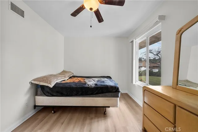 a room with bed and window