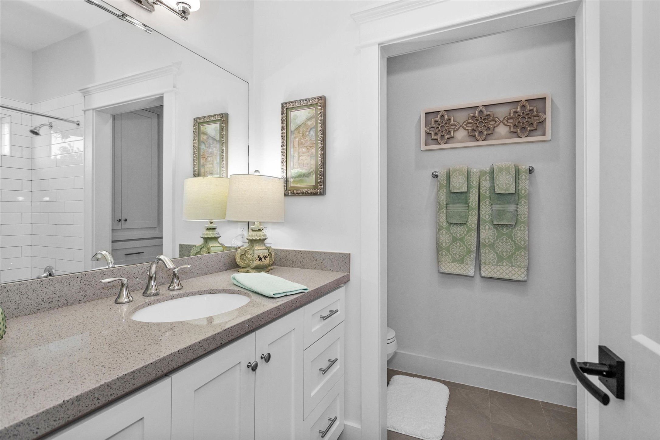 1202 Walton Street Houston, TX 77009 - Photo 23 of 32 Bedroom 2 Features a Private Ensuite Bath, Offering Comfort, Convenience, and a True Suite-Like Experience for Family or Guests.