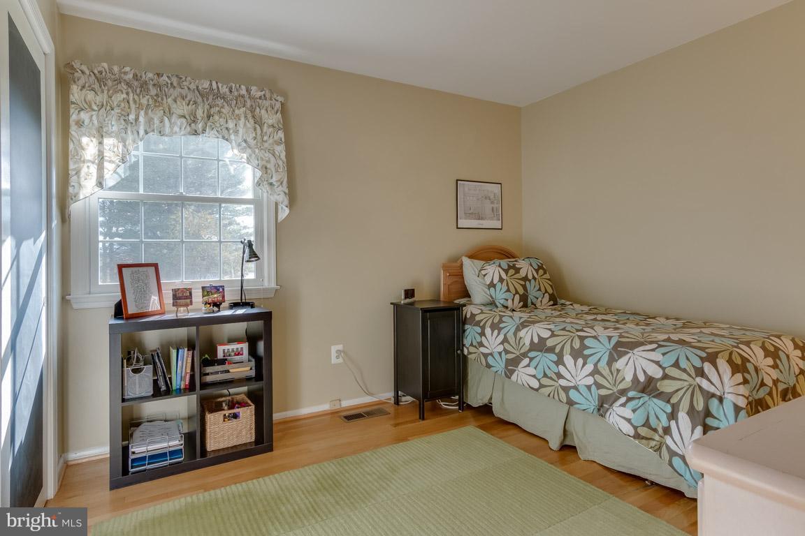 19305 Olney Mill Road Olney, MD 20832 - Photo 14 of 27 a bedroom with a bed and a window