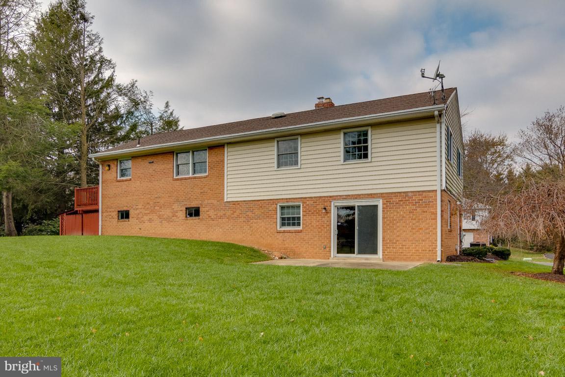 19305 Olney Mill Road Olney, MD 20832 - Photo 22 of 27 a front view of house with yard and trees