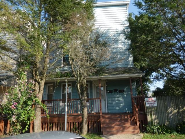 a front view of a house with yard