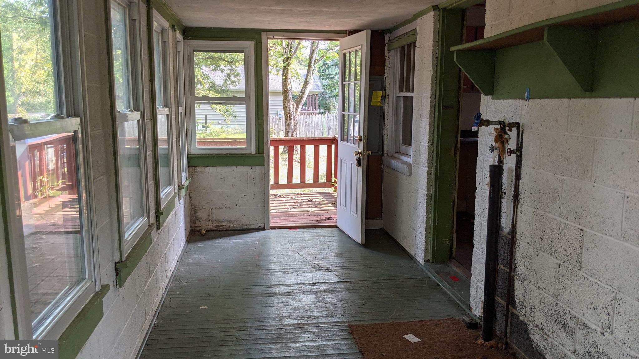 Covered porch with 1/4 bath and laundry hookups