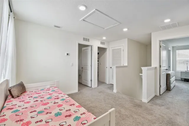 a bedroom with a bed and a view of bathroom