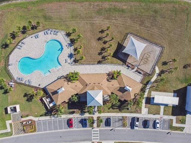 an aerial view of a houses with ocean view