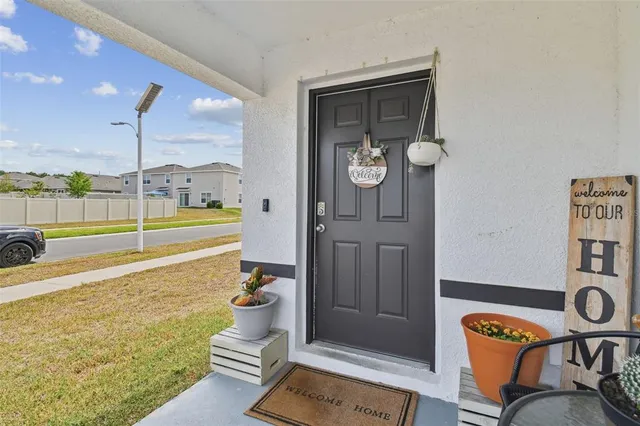 a room with gym equipment and a rug