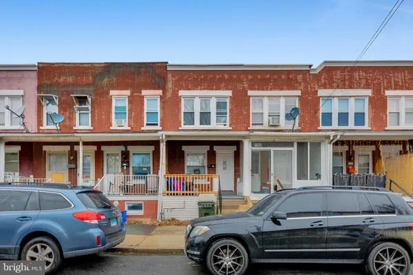 a front view of a house with parking space