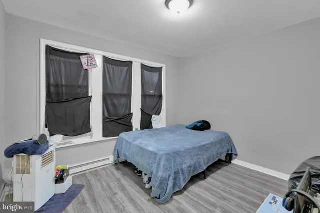 a bedroom with a bed and dresser