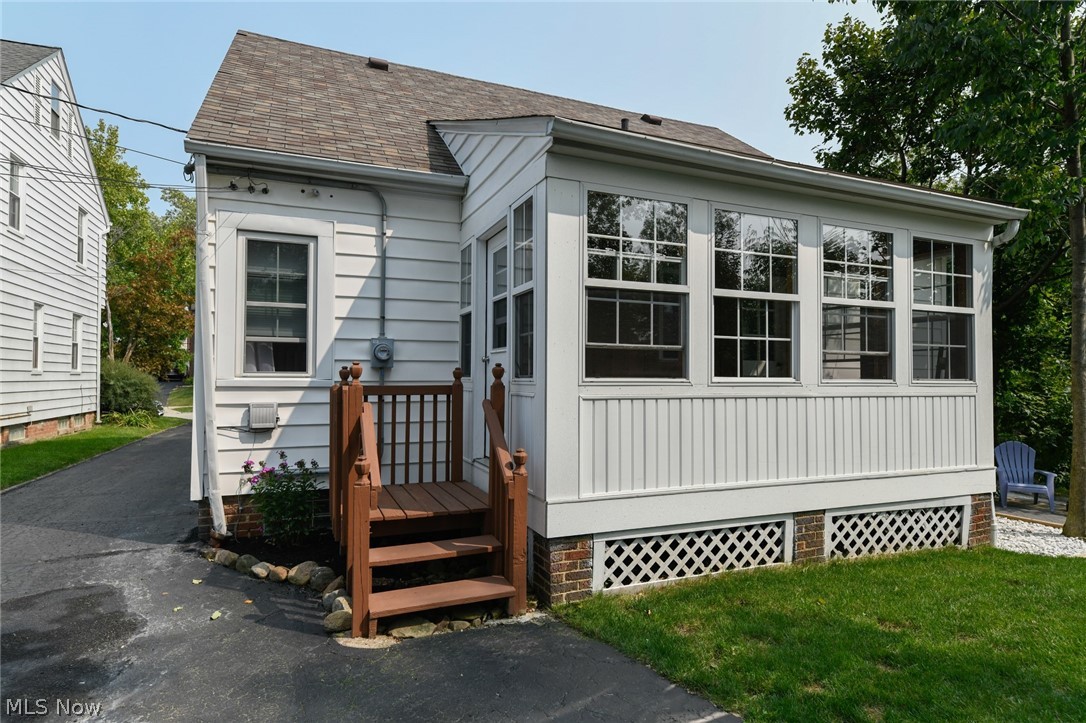 Back of the house with sun room