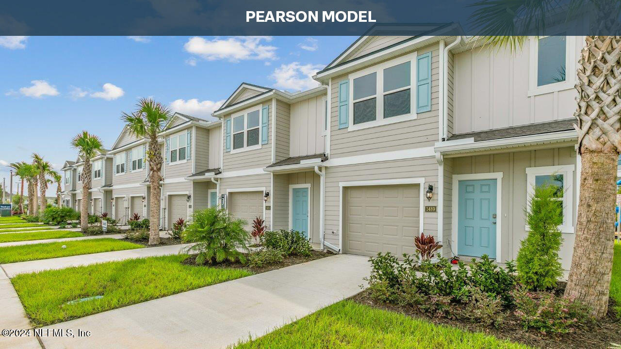 1460 Jeremiah Street Middleburg, FL 32068 - Photo 1 of 39 a front view of a house with a yard