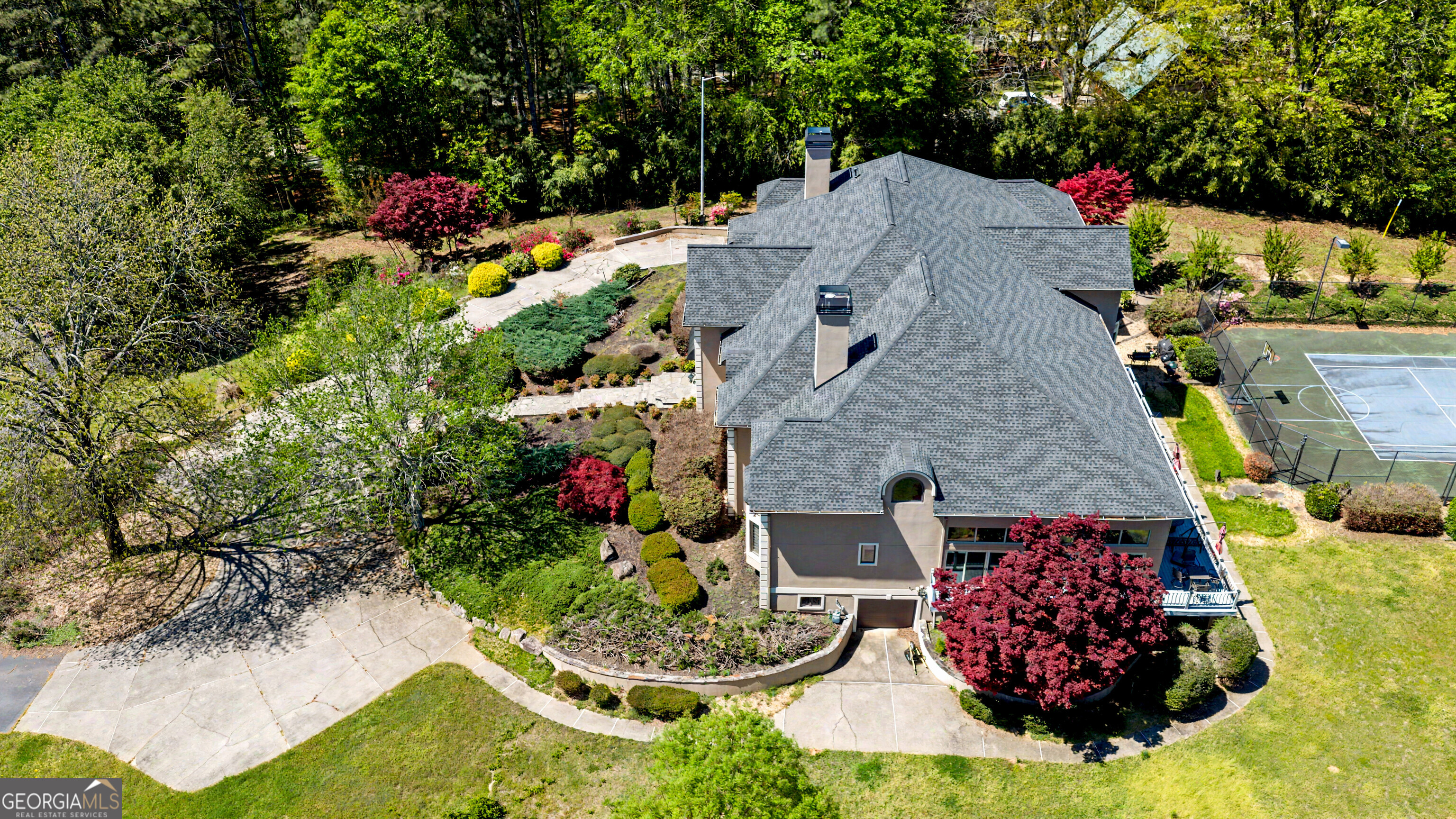 131 Lincoln Road Tyrone, GA 30290 - Photo 71 of 78 an aerial view of a house with a yard and large trees