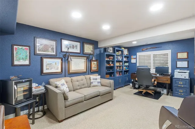 a living room with furniture workspace and a window