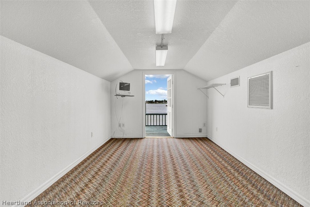 374 Cloverleaf Road Lake Placid, FL 33852 - Photo 19 of 26 wooden floor in an empty room with a window