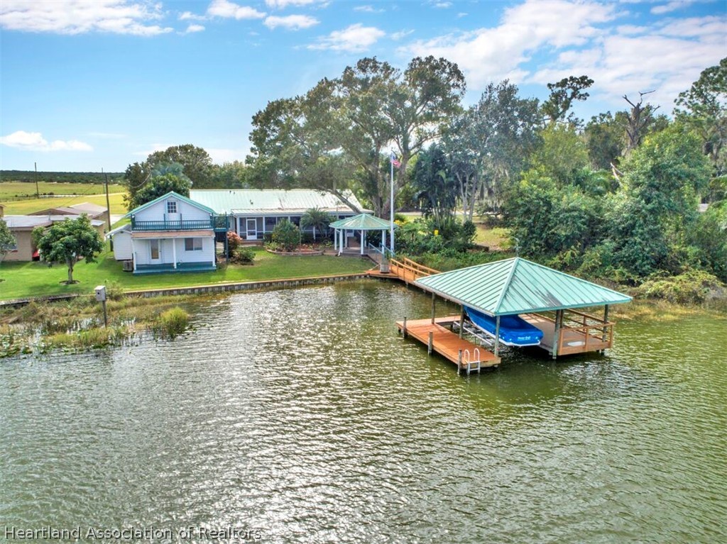 374 Cloverleaf Road Lake Placid, FL 33852 - Photo 2 of 26 a view of a house with pool and a yard with swimming pool