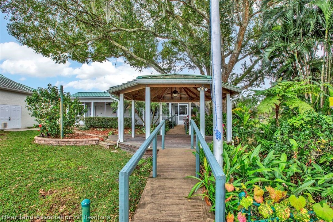 374 Cloverleaf Road Lake Placid, FL 33852 - Photo 21 of 26 a view of a house with backyard and sitting area