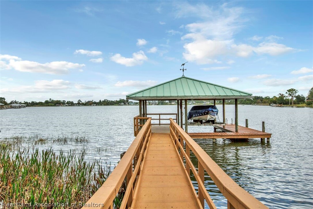 374 Cloverleaf Road Lake Placid, FL 33852 - Photo 22 of 26 a view of a lake with sitting area and lake view